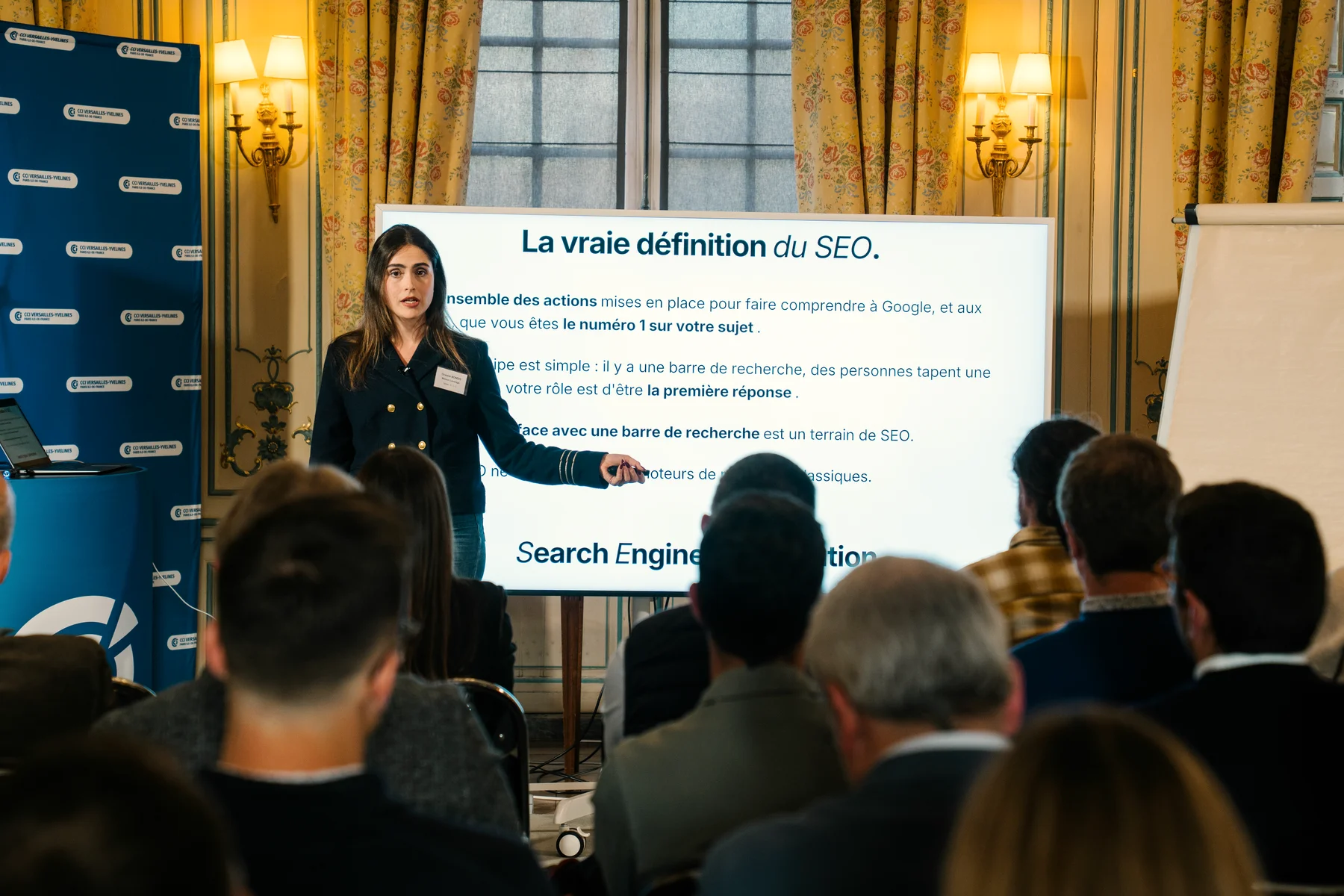 Océane Bondis gives the true definition of SEO to a room of business leaders at the Versailles Chamber of Commerce (CCI)